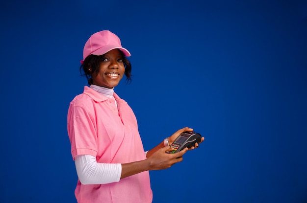 African woman using a point of sale device