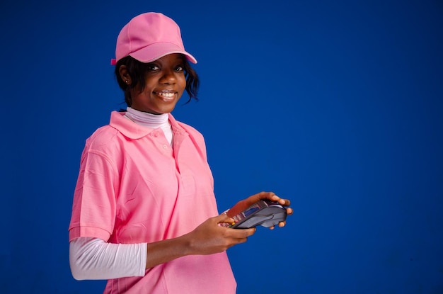 African woman using a point of sale device