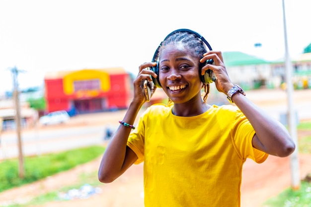 African Woman with headphones listening music