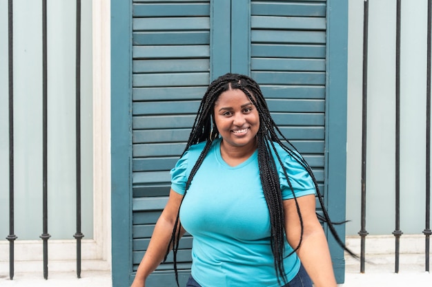 African woman with long hair dancing