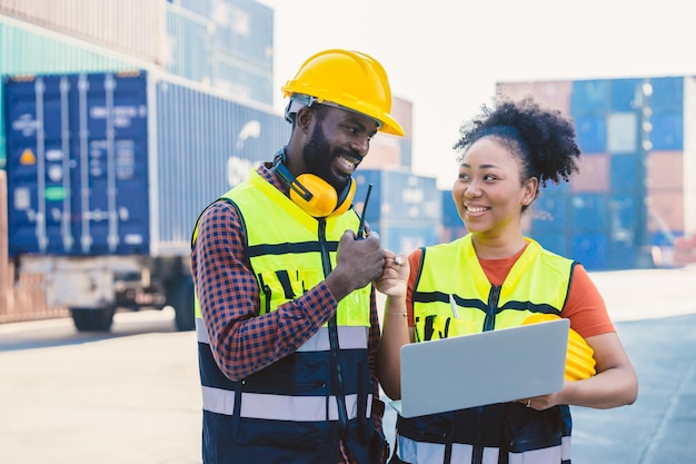 African worker people teamwork happy working together in port cargo shipping industry loading container yard