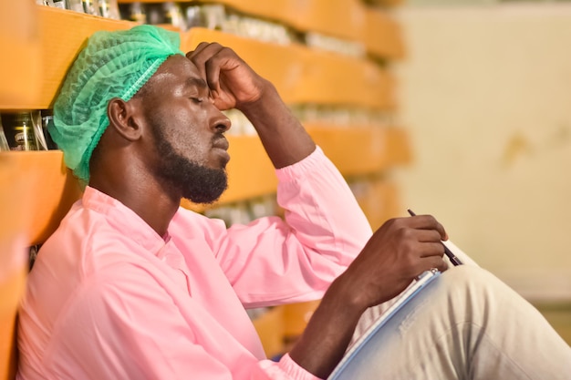 African Worker working in factory