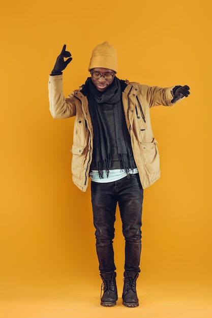 Africanamerican man posing on gray background