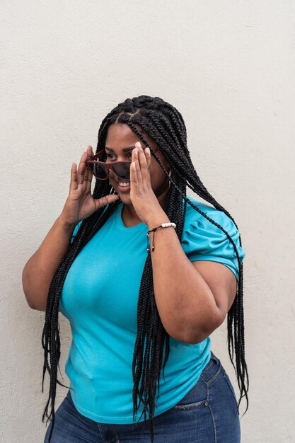 AfricanAmerican model wearing sunglasses on the street