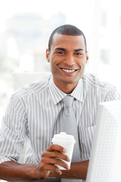 Afro-american businessman drinking a coffee