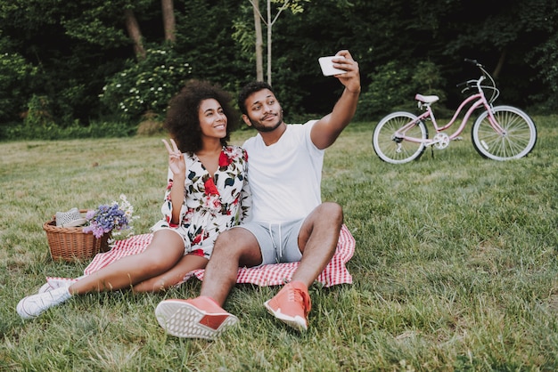 Afro American Couple Doing Selfie On A Picnic Together