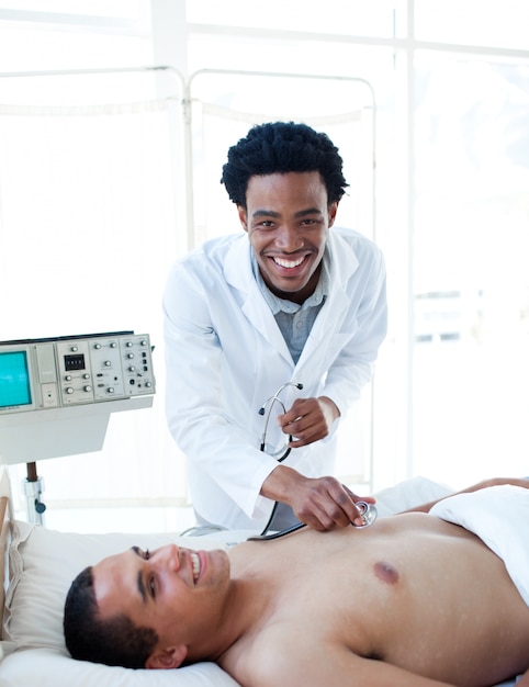 Afro-american doctor examining a patient