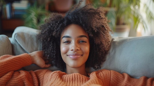 Afro american girl smiling enjoying the day off lying on the couch Healthy Lifestyle