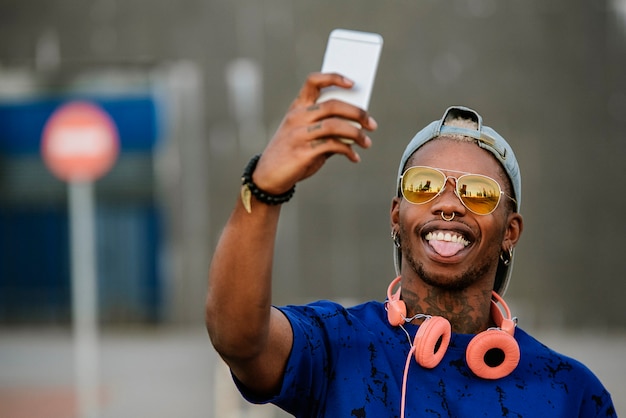 Afro american man posing for a selfie outdoor