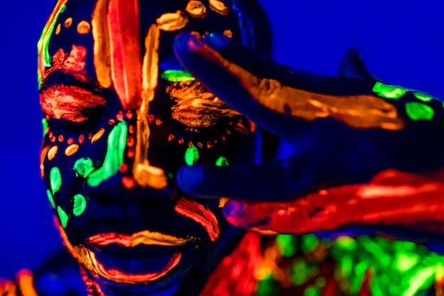 Afro american man posing in studio shot with UV light