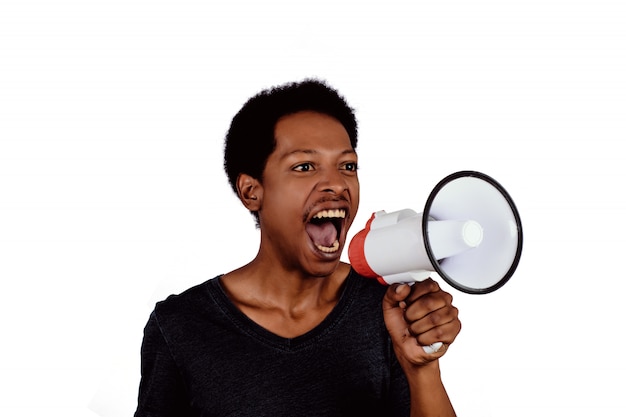 Afro american man screaming on a megaphone.