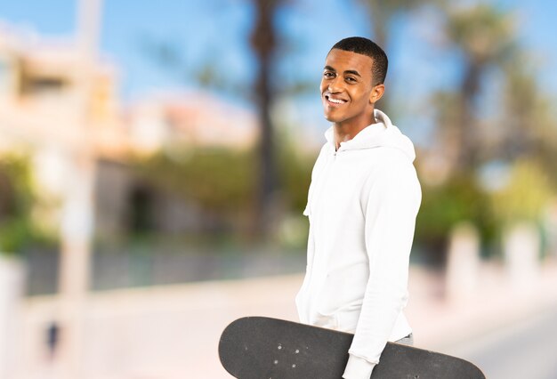 Afro American skater man at outdoors