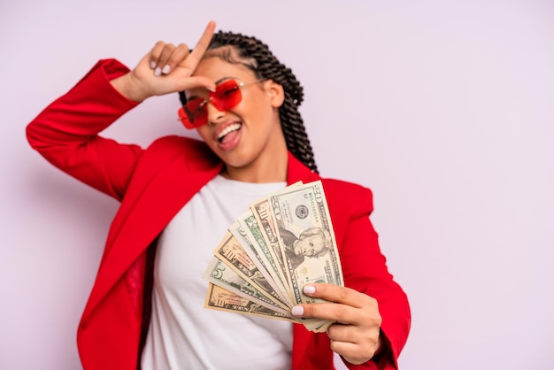 Afro black businesswoman with braids with dollar banknotes