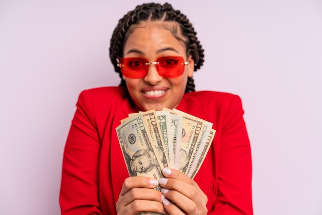 Afro black businesswoman with braids with dollar banknotes