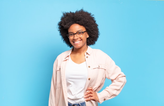 afro black woman against isolated wall