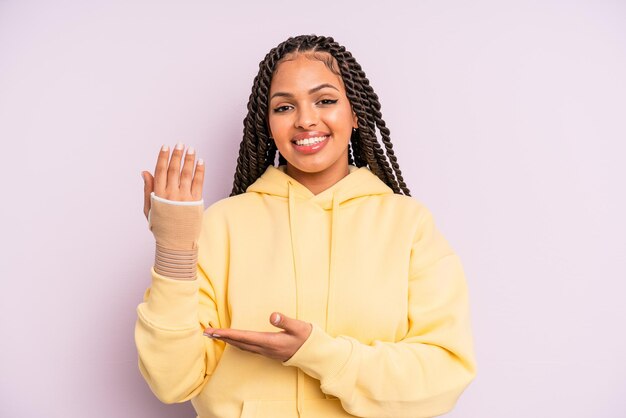 afro black woman with braids. broken hand concept