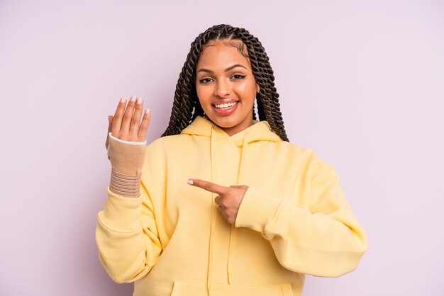 Afro black woman with braids broken hand concept