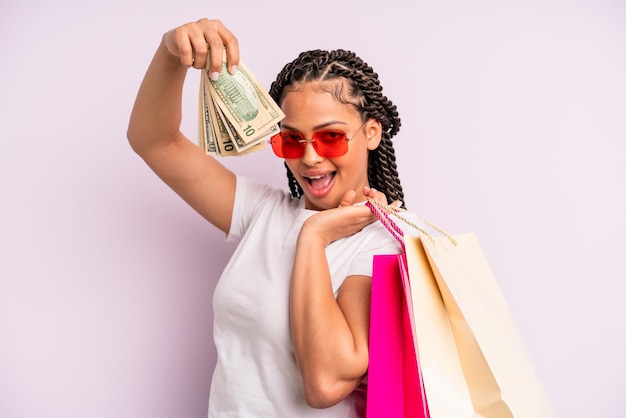 Afro black woman with braids with shopping bags