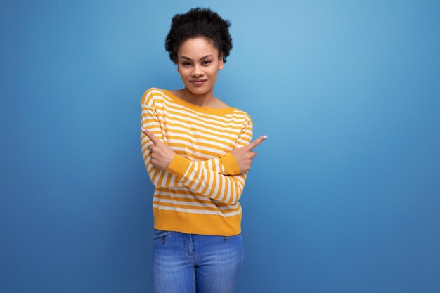 Afro brunette s latin young woman with ponytail in casual wear over isolated background