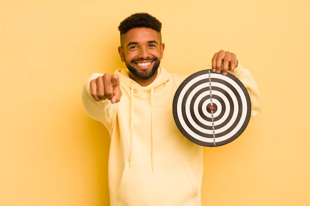 Afro cool man pointing at camera choosing you dart target concept