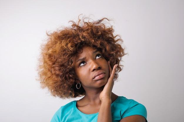 Afro girl thinking