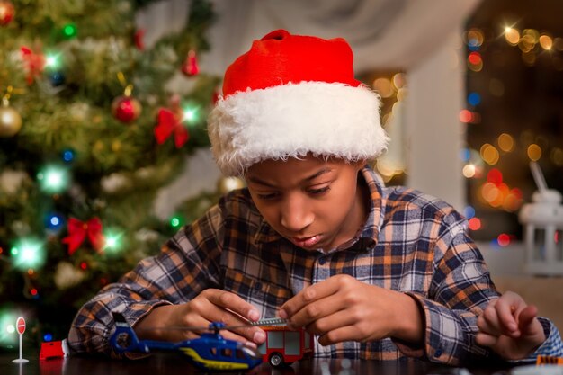 Afro kid playing on Christmas.