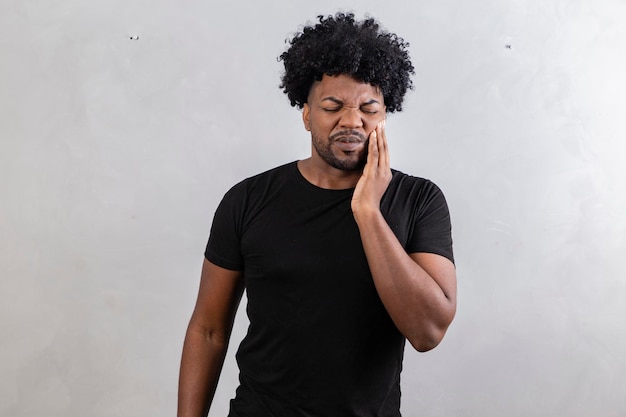 Afro man with toothache oral health concept