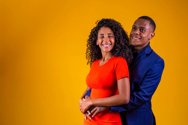 Afro valentine couple in love on yellow background