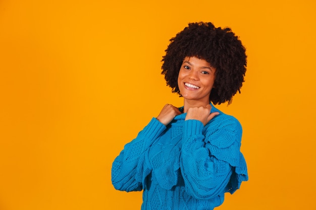 Afro woman dressed for winter