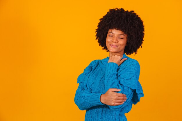 Afro woman dressed for winter