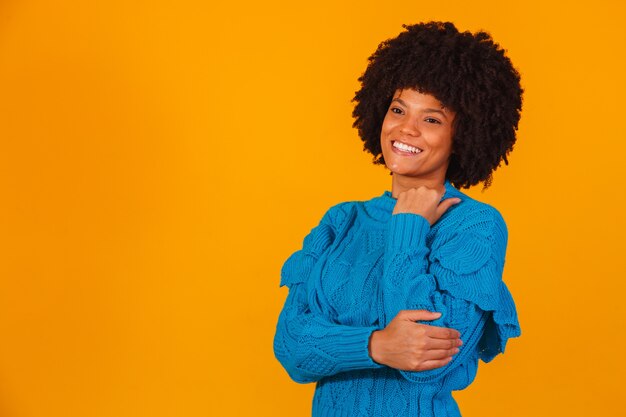 Afro woman dressed for winter