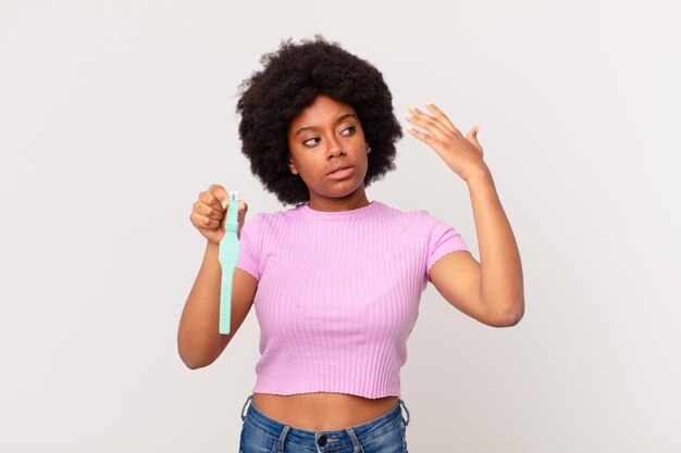 Afro woman feeling stressed, anxious, tired and frustrated, pulling shirt neck, looking frustrated with problem watch concept