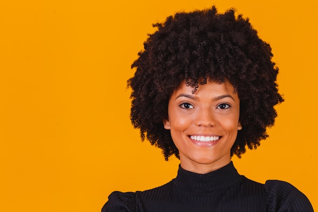 Afro woman with blackpower hair smiling. Afro woman