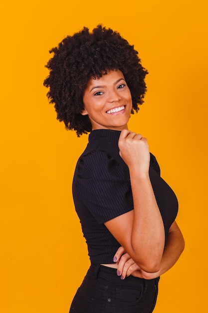 Afro woman with blackpower hair smiling. Afro woman