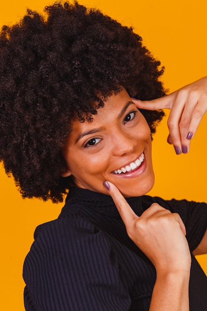 Afro woman with blackpower hair smiling. Afro woman