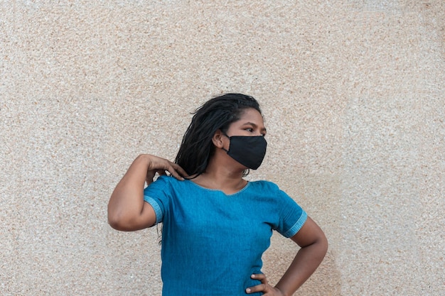 Afro woman with protective mask