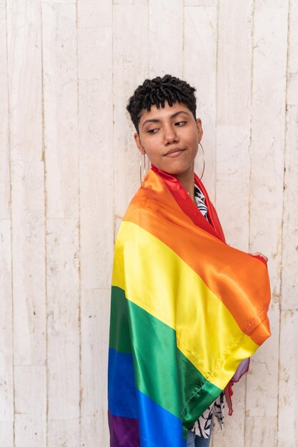 Afro woman wrapped in pride flag