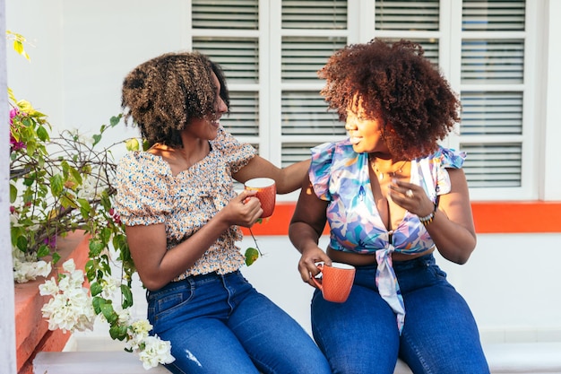 Afro women taking a coffee break at the cafe