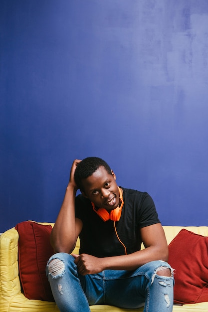 Afroamerican Guy Headphones Home Leisure Man Lazy Young Meloman Music scene Concept