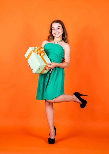 After successful shopping happy birthday holiday anniversary present cyber monday concept smiling child with birthday gift childhood happiness pretty teenage girl kid holiday shopping