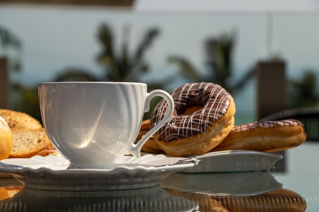 afternoon tea served on a decorated table, afternoon coffee, croissant, cheese bread, various foods