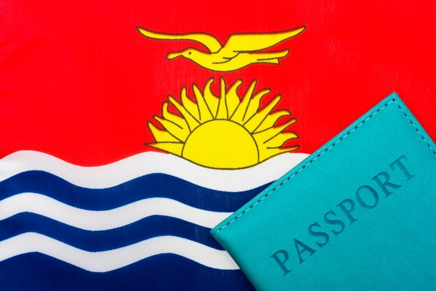 Against the background of the kiribati flag is a passport