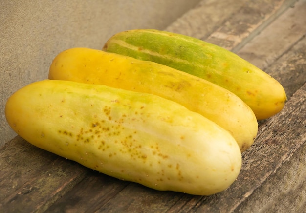 Aged cucumbers on wooden background Grown to produce seeds