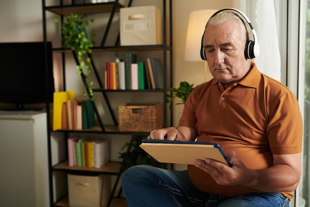 Aged Man Listening to Music