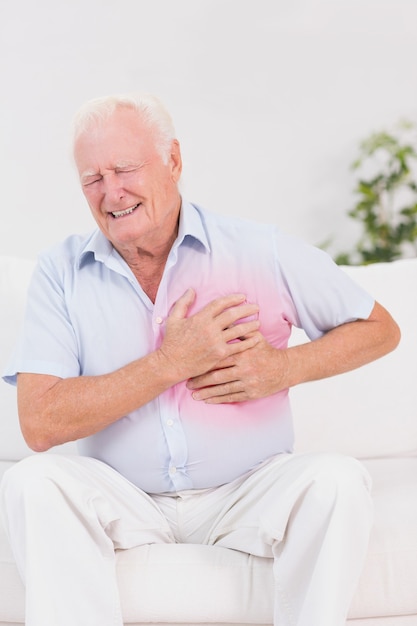 aged man suffering with heart pain