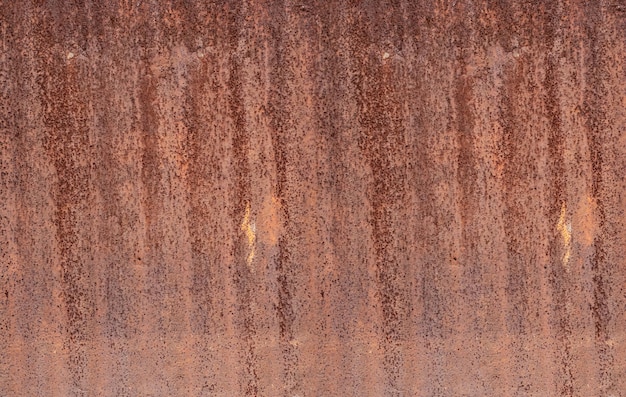 Photo aged old corrugated iron sheet with brown rustic texture for background