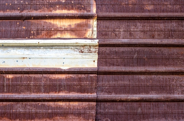 Photo aged old rusty corrugated iron sheet close up view for texture background