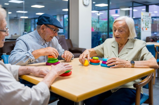 Aged people in a nursing home sharing skills games