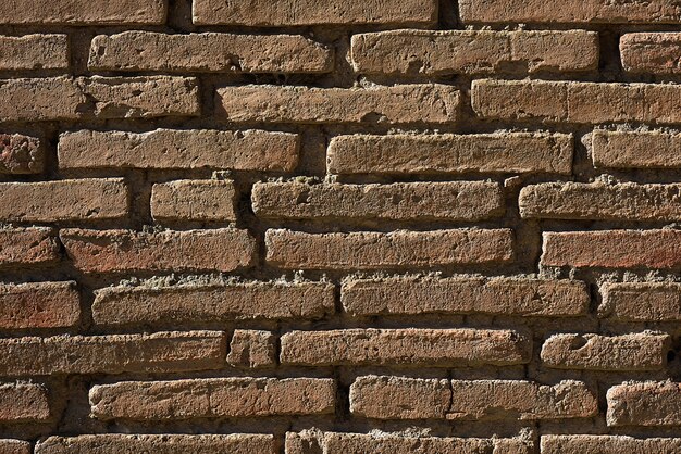 Photo aged red brick textured wall