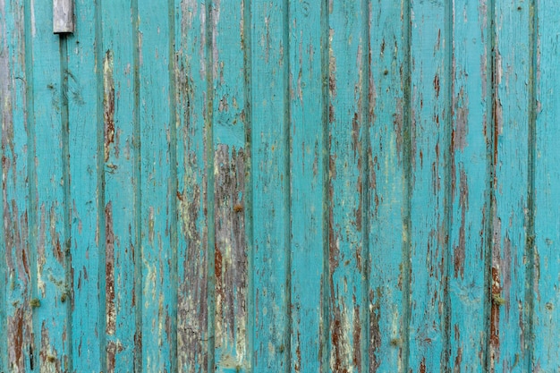 Aged rustic wooden background texture in blue.